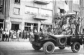  The coup d'état makers (the Shah's troops) carrying the portrait of the Shah, August 19, 1953